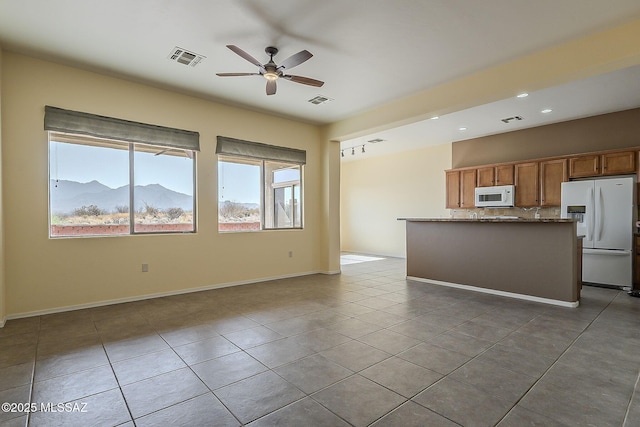 unfurnished living room featuring visible vents, tile patterned floors, a ceiling fan, and recessed lighting