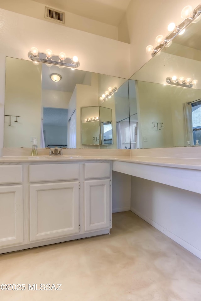 bathroom with visible vents and vanity