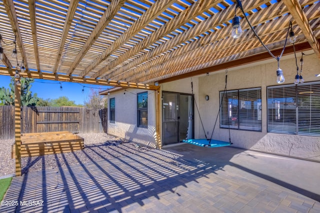 view of patio / terrace featuring fence and a pergola