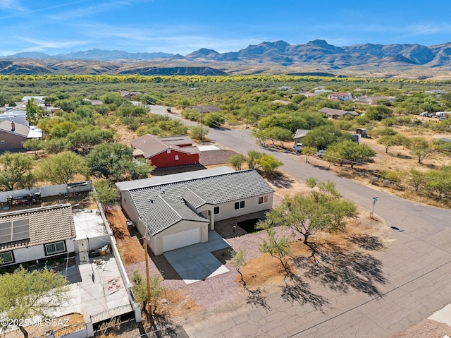 drone / aerial view featuring a mountain view