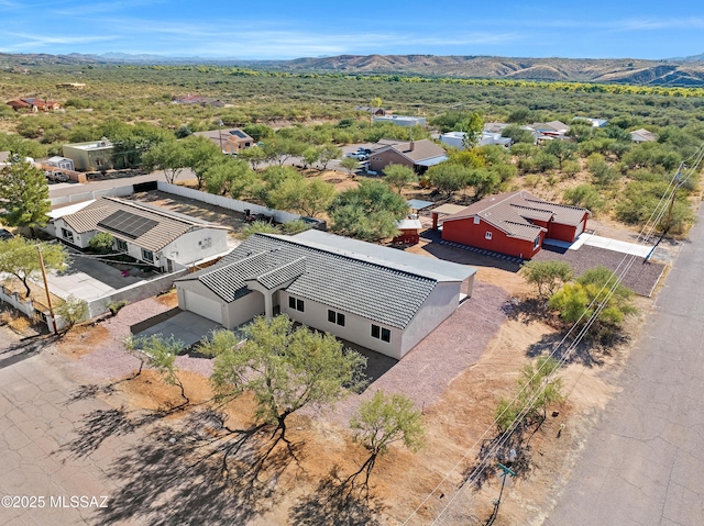 birds eye view of property with a mountain view
