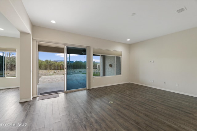 13906 N Rim Trl, Marana, AZ 85658 - spare room featuring dark wood-type flooring, recessed lighting, and baseboards