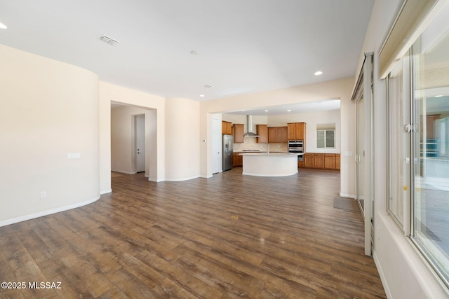 13906 N Rim Trl, Marana, AZ 85658 - unfurnished living room featuring dark wood-style floors, recessed lighting, and baseboards