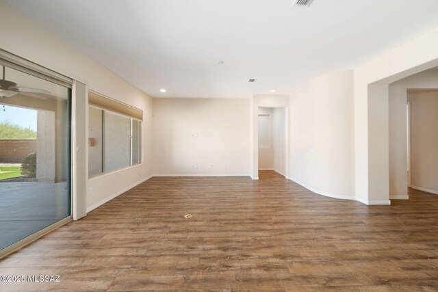 13906 N Rim Trl, Marana, AZ 85658 - unfurnished room featuring wood finished floors, recessed lighting, baseboards, and ceiling fan