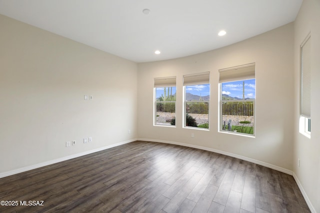 13906 N Rim Trl, Marana, AZ 85658 - unfurnished room featuring baseboards, dark wood finished floors, and recessed lighting