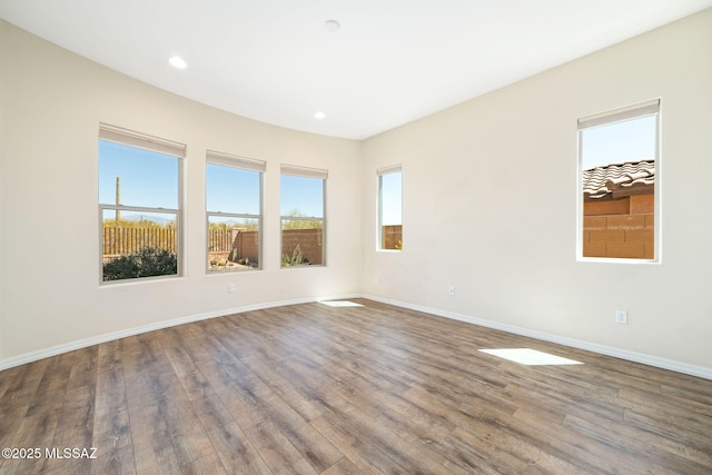 13906 N Rim Trl, Marana, AZ 85658 - unfurnished room with wood finished floors, baseboards, and recessed lighting