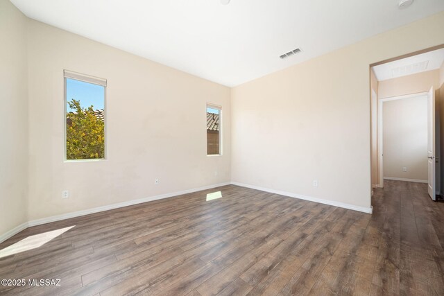 13906 N Rim Trl, Marana, AZ 85658 - unfurnished room with dark wood-style floors and baseboards