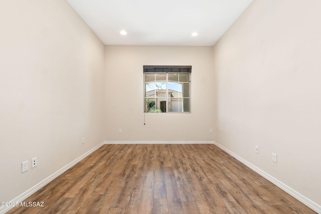 13906 N Rim Trl, Marana, AZ 85658 - unfurnished room featuring wood finished floors, baseboards, and recessed lighting