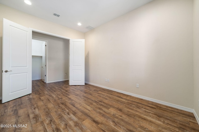 13906 N Rim Trl, Marana, AZ 85658 - spare room featuring dark wood finished floors, baseboards, and recessed lighting