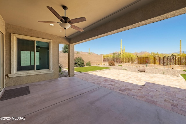 13906 N Rim Trl, Marana, AZ 85658 - view of patio featuring a ceiling fan and a fenced backyard