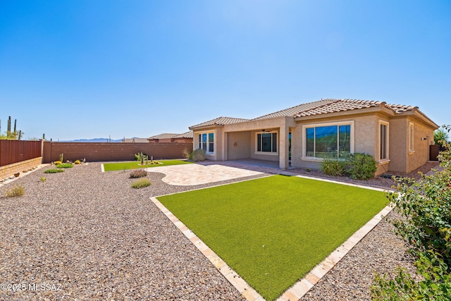 13906 N Rim Trl, Marana, AZ 85658 - rear view of property featuring stucco siding, a tile roof, and a patio area