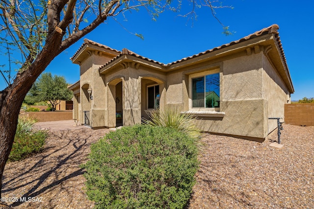 13906 N Rim Trl, Marana, AZ 85658 - mediterranean / spanish house with stucco siding, a tiled roof, and fence