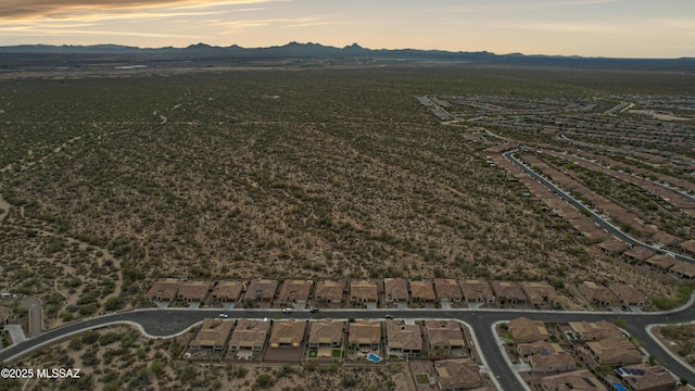 13906 N Rim Trl, Marana, AZ 85658 - aerial overview of property's location featuring a mountainous background and nearby suburban area