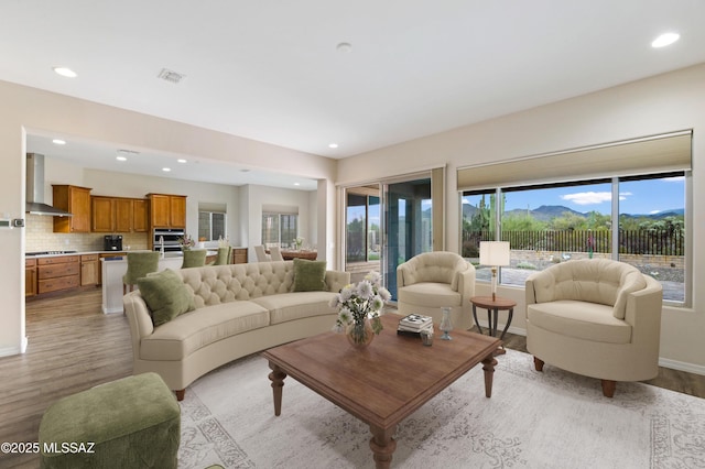 13906 N Rim Trl, Marana, AZ 85658 - living room featuring light wood-style floors, recessed lighting, and baseboards