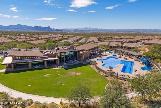 13906 N Rim Trl, Marana, AZ 85658 - aerial view of residential area featuring a mountainous background and a pool area