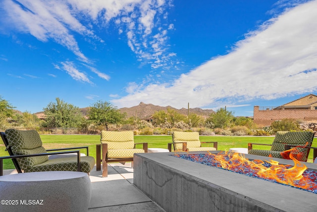 13906 N Rim Trl, Marana, AZ 85658 - view of patio with a mountain view and an outdoor living space with a fire pit