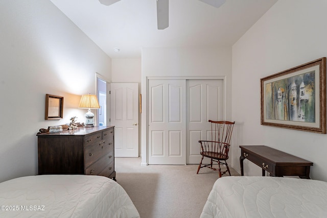 bedroom featuring light carpet, a closet, and ceiling fan