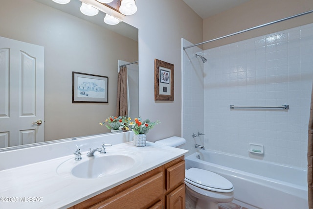 bathroom with toilet, shower / bath combo, and vanity