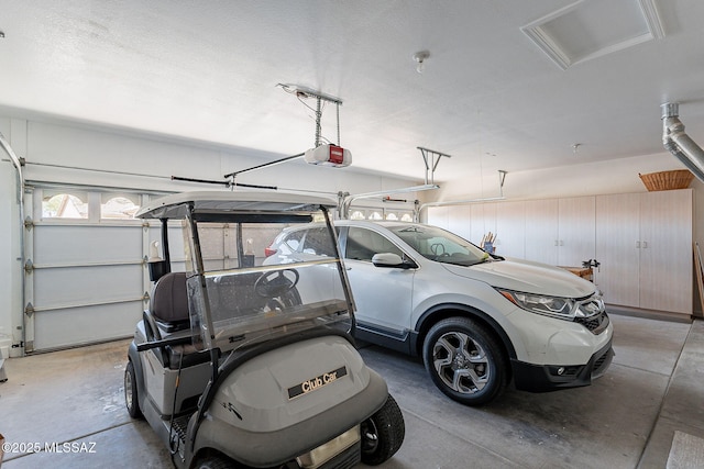 garage featuring a garage door opener