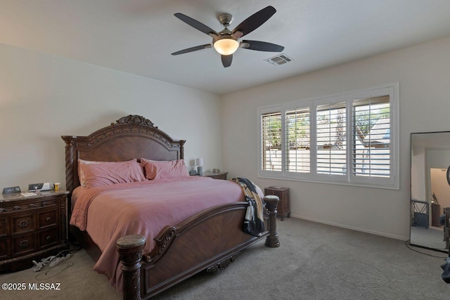 bedroom featuring baseboards, visible vents, a ceiling fan, and carpet floors