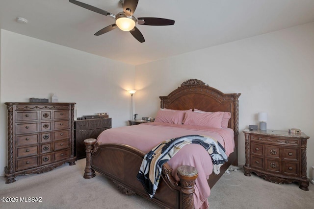 carpeted bedroom with a ceiling fan