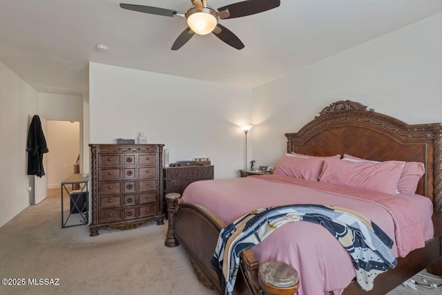 bedroom featuring ceiling fan and carpet