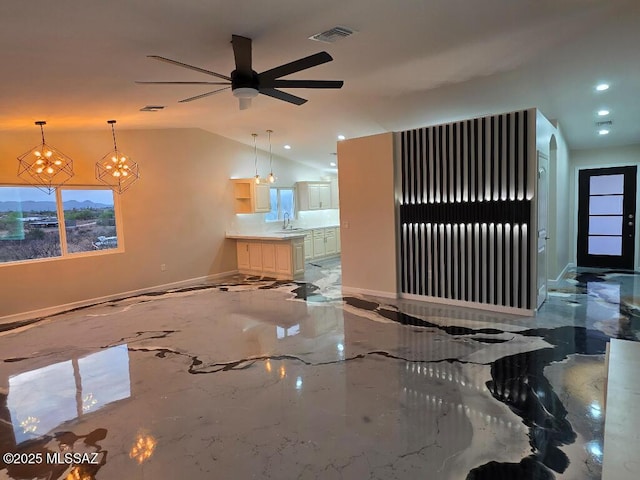 unfurnished living room with baseboards, recessed lighting, visible vents, marble finish floor, and a sink