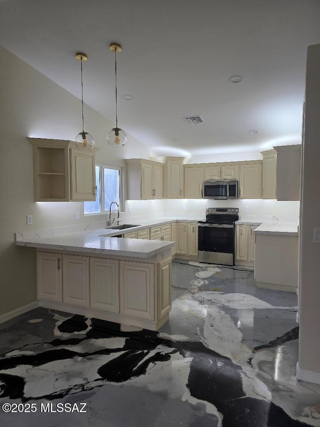 kitchen with a peninsula, visible vents, appliances with stainless steel finishes, marble finish floor, and a sink