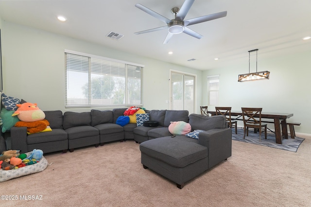 3295 W Sunlit Peak Dr, Tucson, AZ 85742 - living area with light carpet, visible vents, plenty of natural light, and recessed lighting
