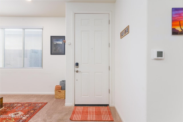 3295 W Sunlit Peak Dr, Tucson, AZ 85742 - entryway featuring baseboards and carpet floors