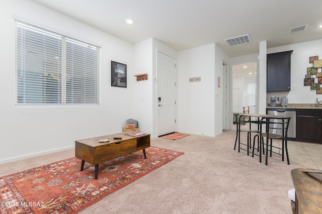 3295 W Sunlit Peak Dr, Tucson, AZ 85742 - living room featuring light carpet, recessed lighting, visible vents, and baseboards