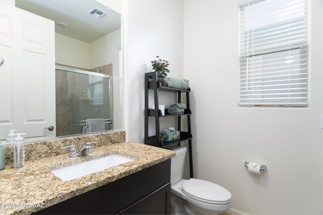 3295 W Sunlit Peak Dr, Tucson, AZ 85742 - bathroom with visible vents, toilet, a stall shower, and vanity