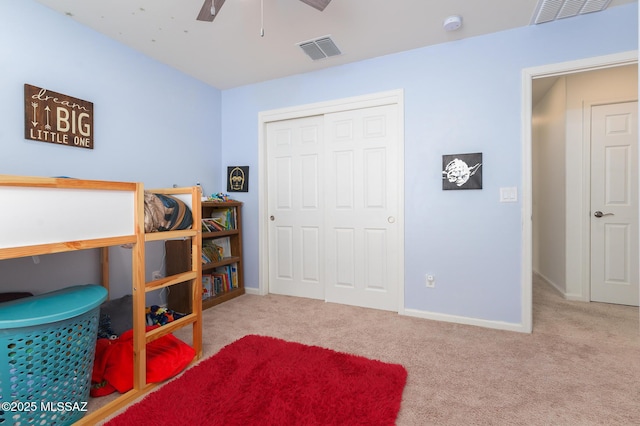 3295 W Sunlit Peak Dr, Tucson, AZ 85742 - carpeted bedroom with a closet, baseboards, a ceiling fan, and visible vents