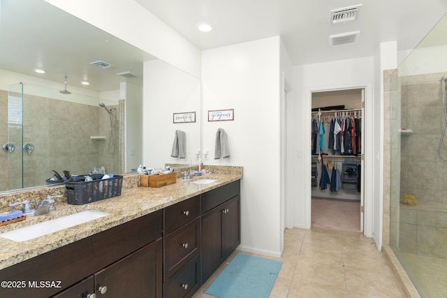 3295 W Sunlit Peak Dr, Tucson, AZ 85742 - bathroom featuring a shower stall, a sink, and visible vents