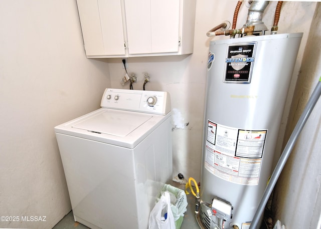 laundry room with gas water heater, cabinet space, and washer / dryer