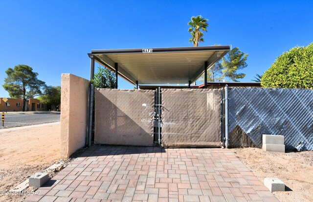 view of gate with fence