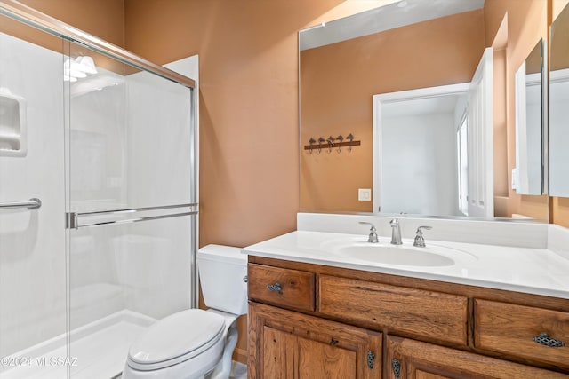 bathroom with toilet and a shower stall