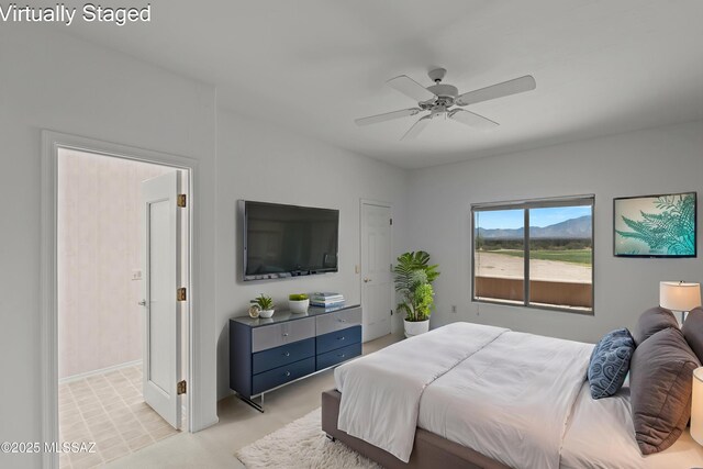 bedroom featuring baseboards and a ceiling fan