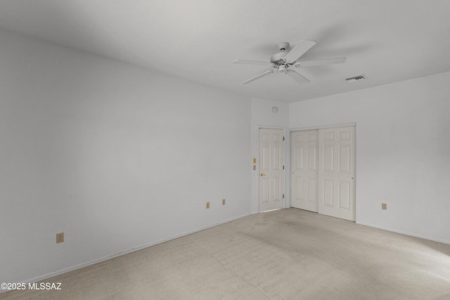 unfurnished bedroom with light carpet and baseboards