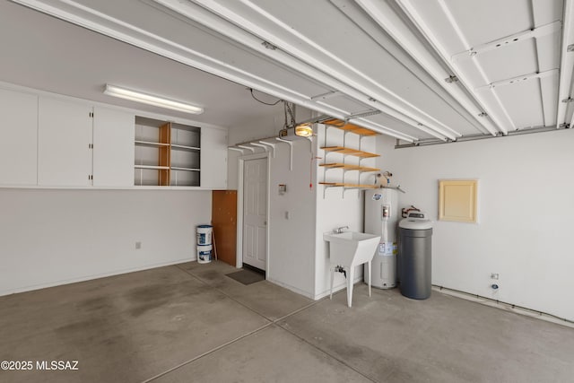 garage with a sink and water heater