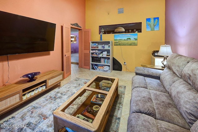 tiled living area featuring visible vents