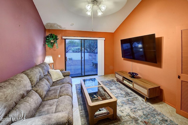 tiled living room featuring ceiling fan and vaulted ceiling