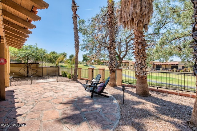 view of patio featuring fence