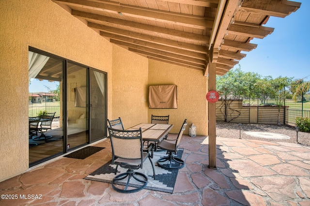 view of patio / terrace with outdoor dining space and fence