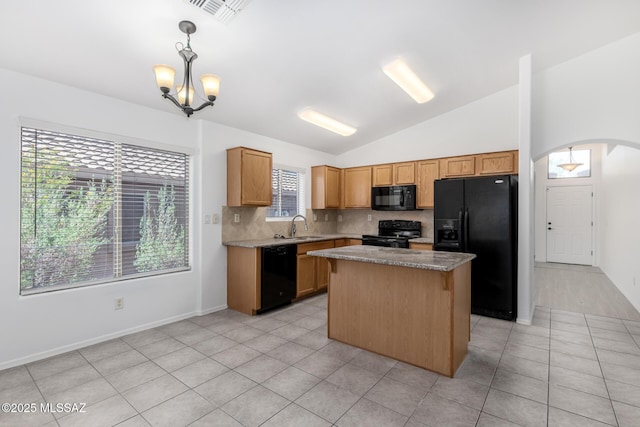 13140 E Mesquite Flat Spring Dr, Vail, AZ 85641 - kitchen featuring black appliances, lofted ceiling, tasteful backsplash, a chandelier, and light tile patterned floors