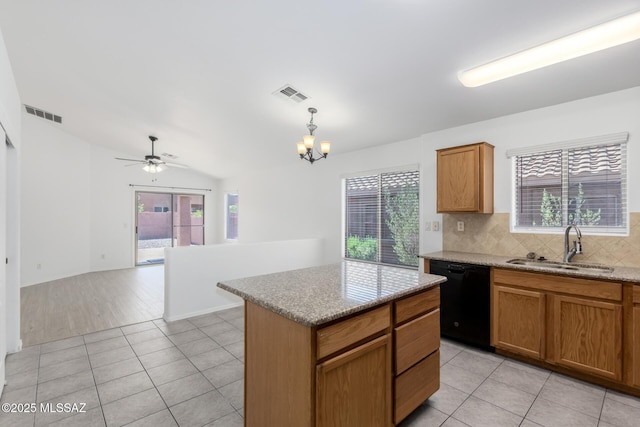 13140 E Mesquite Flat Spring Dr, Vail, AZ 85641 - kitchen with black dishwasher, a sink, a ceiling fan, decorative backsplash, and light tile patterned floors