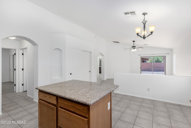 13140 E Mesquite Flat Spring Dr, Vail, AZ 85641 - kitchen with lofted ceiling, arched walkways, light tile patterned floors, a chandelier, and a ceiling fan