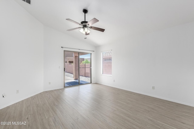 13140 E Mesquite Flat Spring Dr, Vail, AZ 85641 - spare room featuring ceiling fan, wood finished floors, vaulted ceiling, and baseboards
