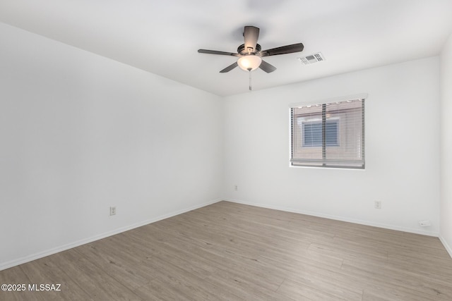 13140 E Mesquite Flat Spring Dr, Vail, AZ 85641 - unfurnished room featuring ceiling fan, light wood-type flooring, and baseboards