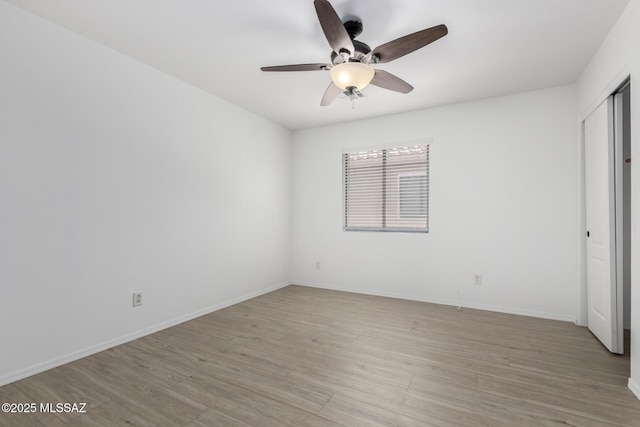 13140 E Mesquite Flat Spring Dr, Vail, AZ 85641 - unfurnished bedroom with light wood-style flooring, baseboards, a closet, and ceiling fan